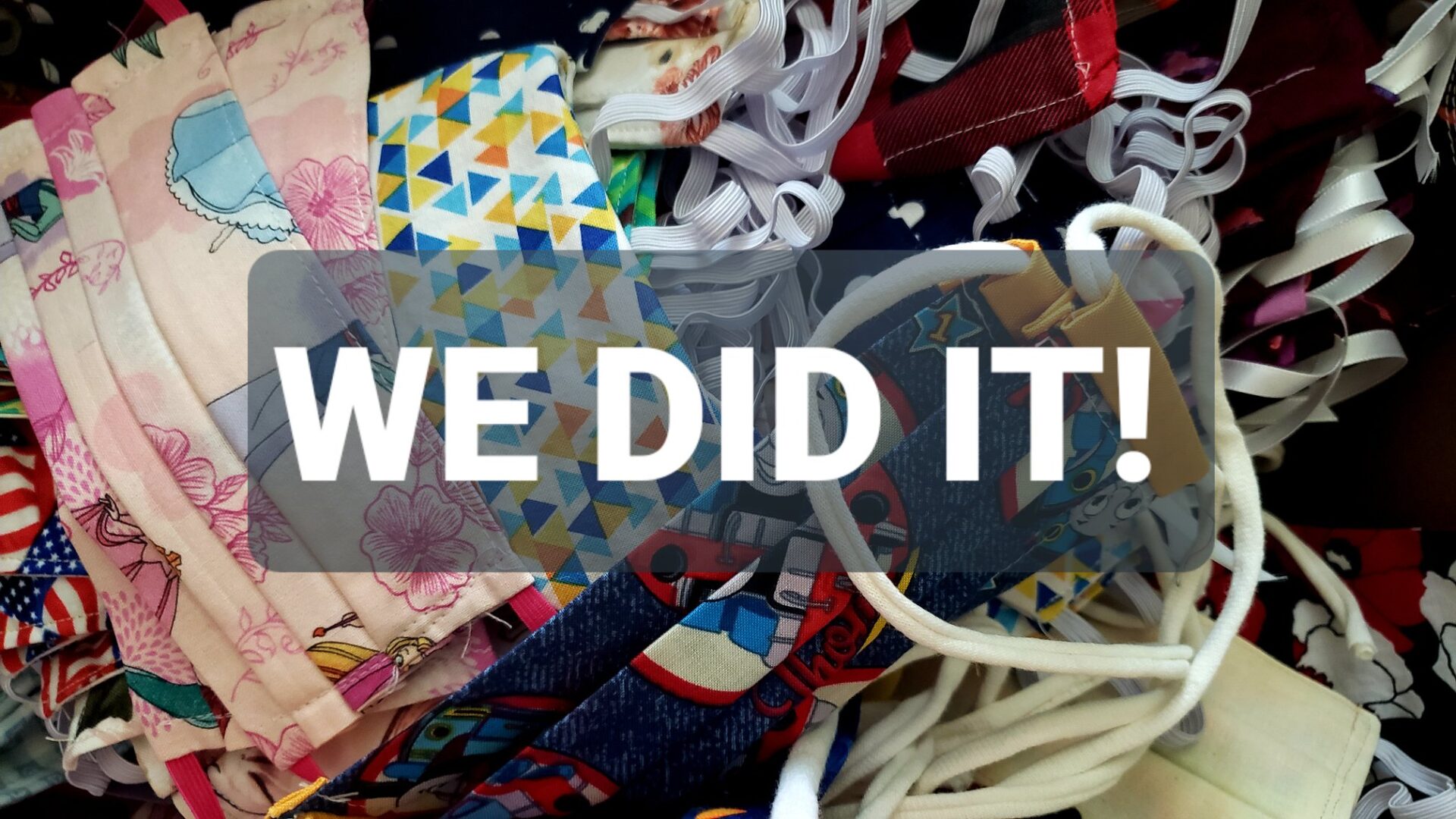 FaceMaskDrive-complete Close up photo of face masks in a pile with text "We Did It!"
